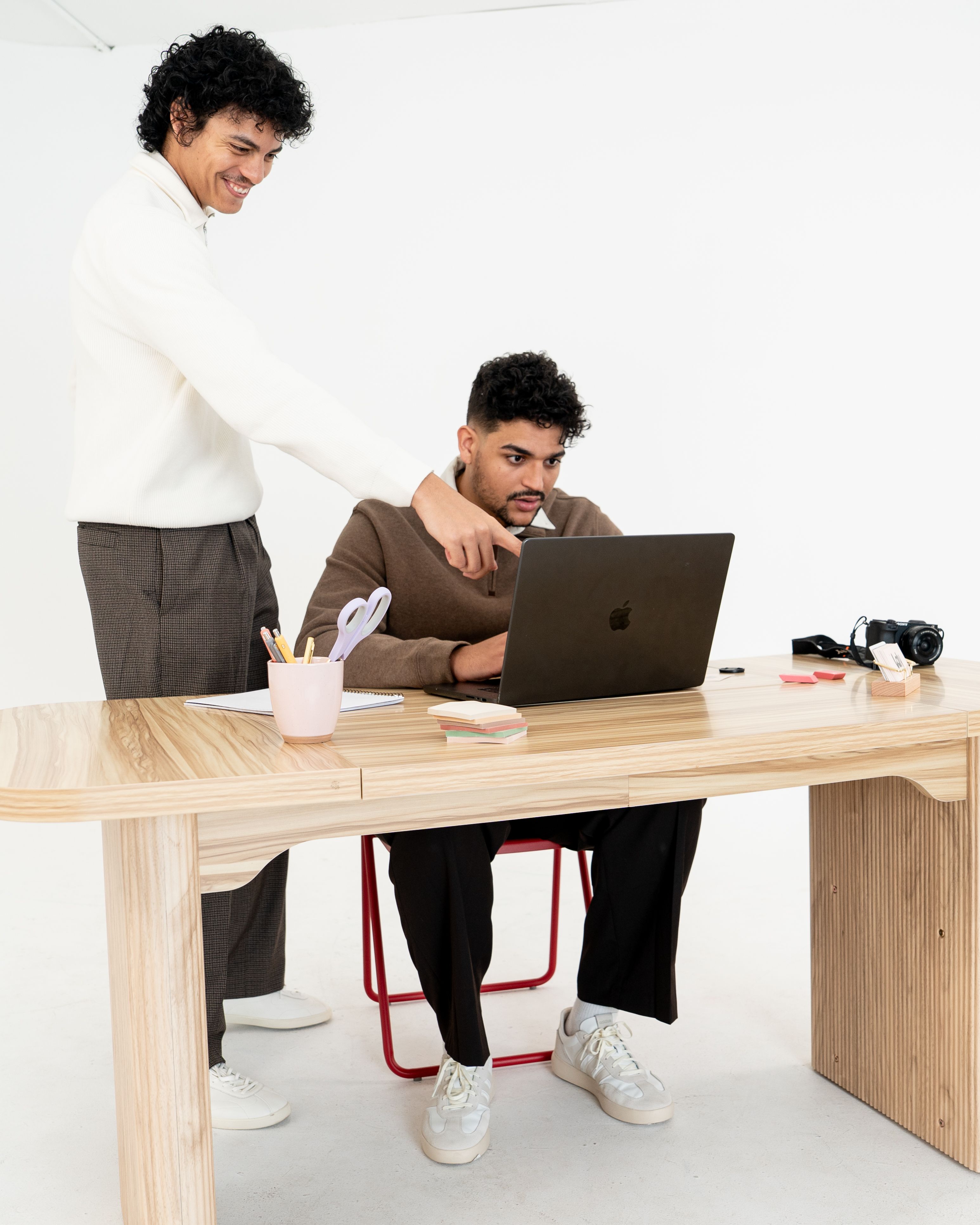 Laly team members, Ramon Ripoll-Martinez and Leonardo Sequani, working together on the laptop.